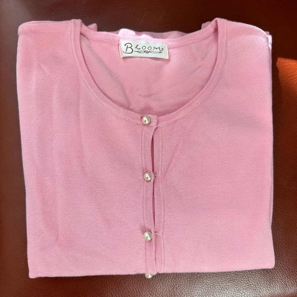 Three quarter sleeve pearl button cardigan in pink color